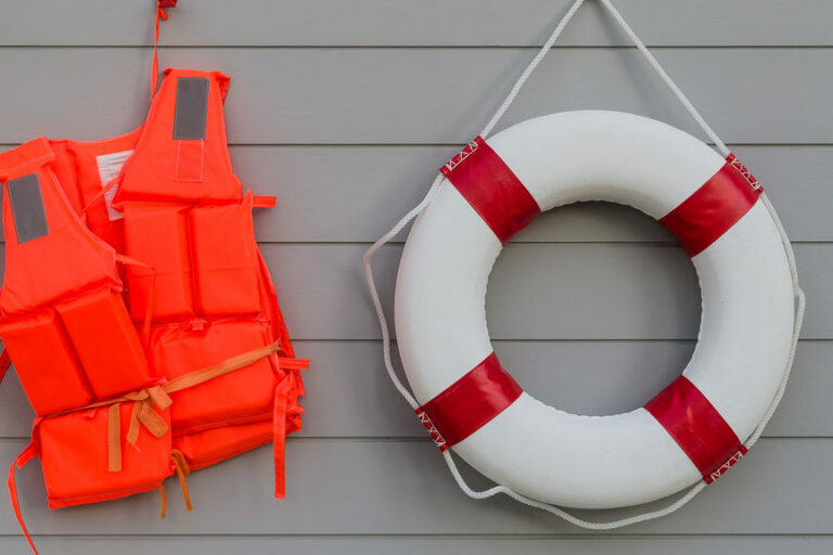 Life,Vest,And,Life,Belt,On,Wooden,Wall