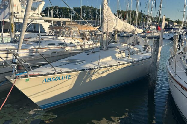 1984 C&C 41 sailboat named “Absolute” docked at a marina.
