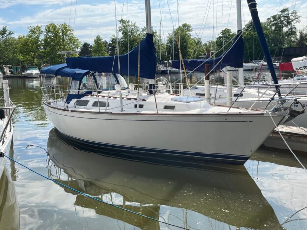 1988 Sabre 34 MK II sailboat docked in marina.