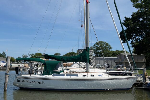 1987 Catalina 34 sailboat named “Irish Blessing” docked at a marina.